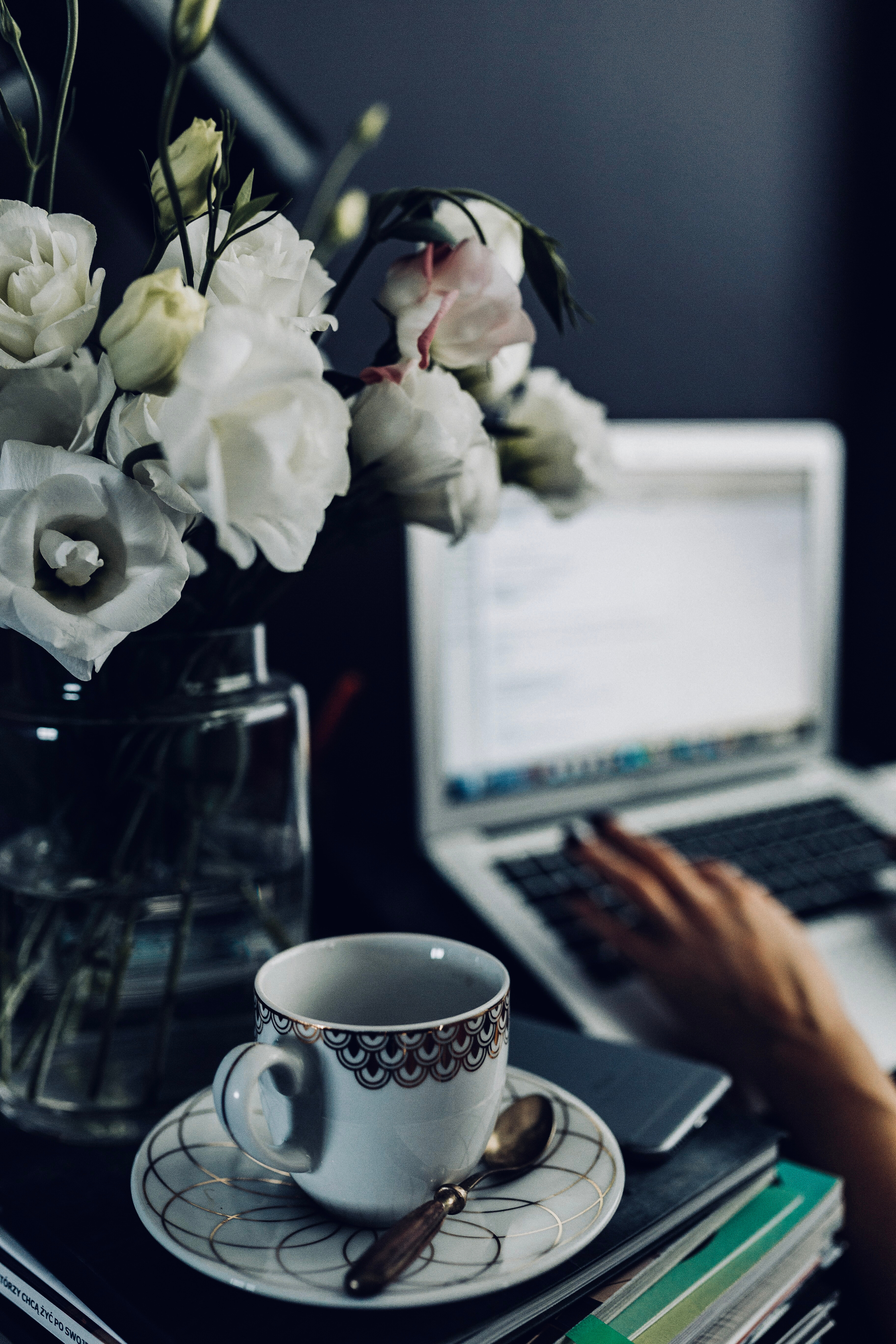 typing laptop, cup of tea, flowers